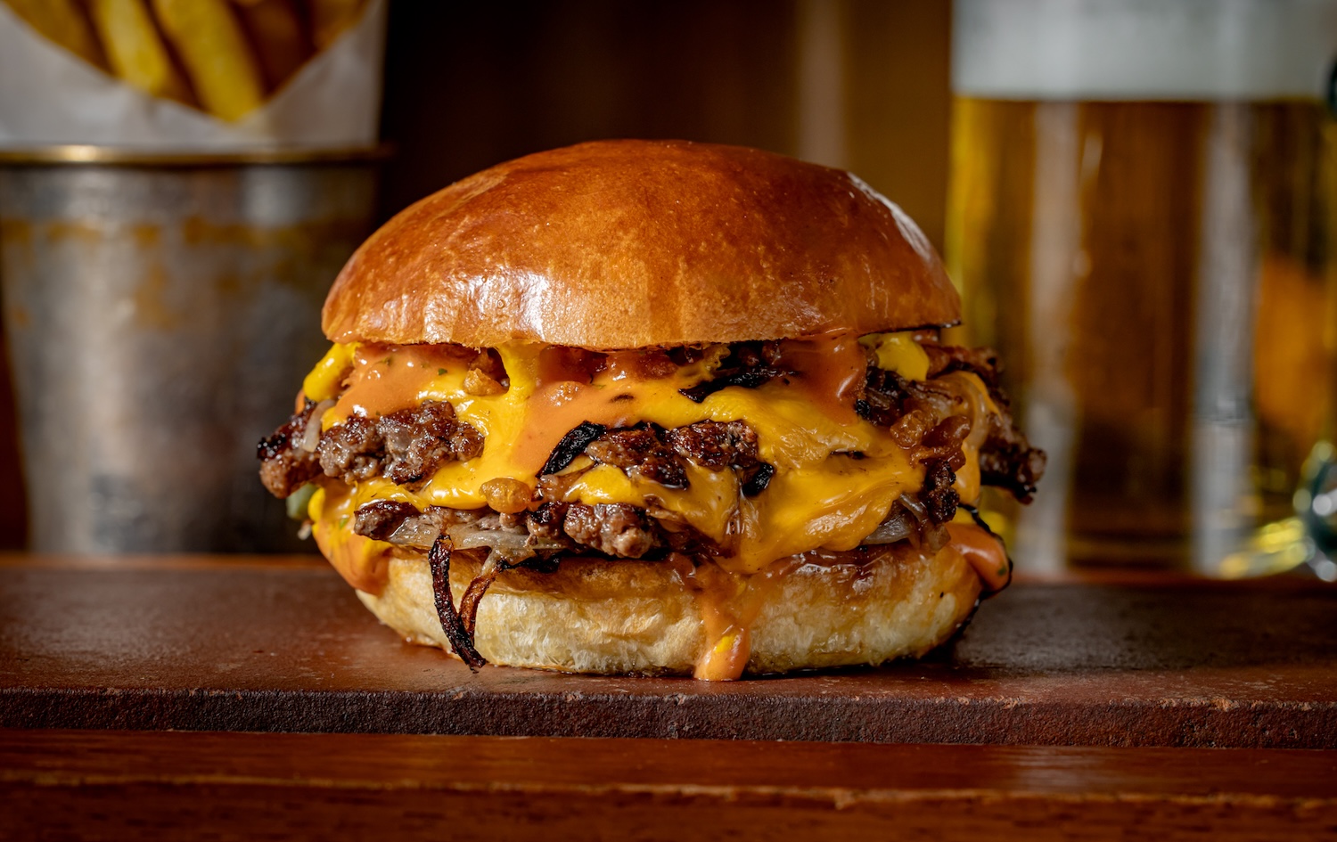 Flat Iron Launches New Smashed Onion Double Cheeseburger